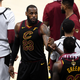 LeBron James, No. 23 of the Cleveland Cavaliers, reacts with Jeff Green, No. 32, late in the game against the Golden State Warriors during Game 4 of the 2018 NBA Finals at Quicken Loans Arena on June 8, 2018, in Cleveland.